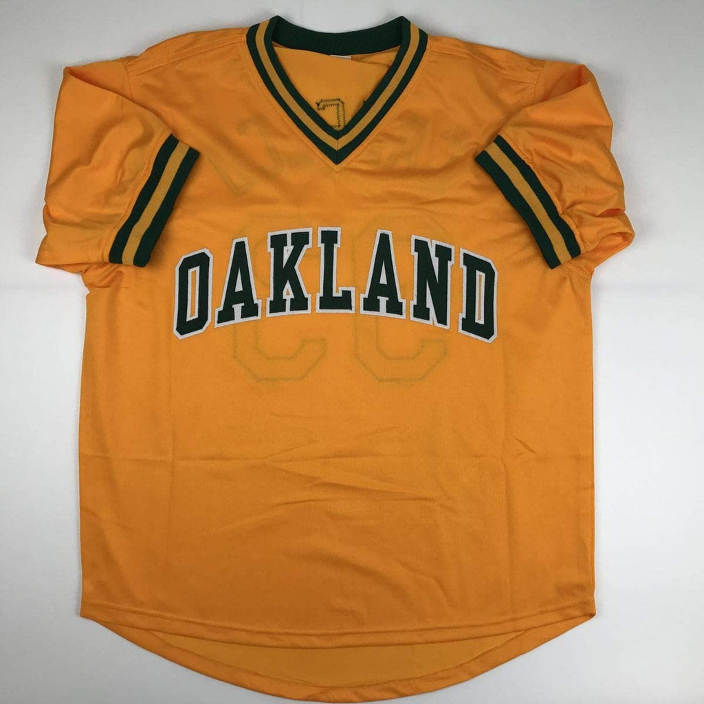 Autographed/Signed Jose Canseco Oakland Yellow Baseball Jersey JSA COA